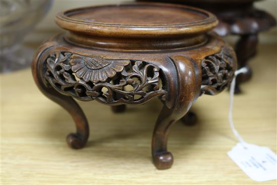 Two Chinese hardwood stands largest 20cm diameter